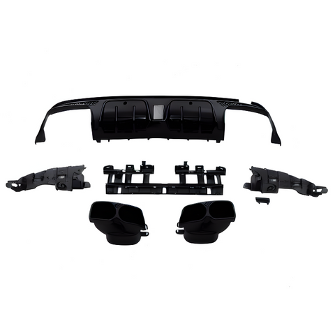 Automobile rear bumper diffuser parts, disassembled and laid out; includes end pieces, exhaust tips, and center grille. The components are black and arranged against a plain white background.