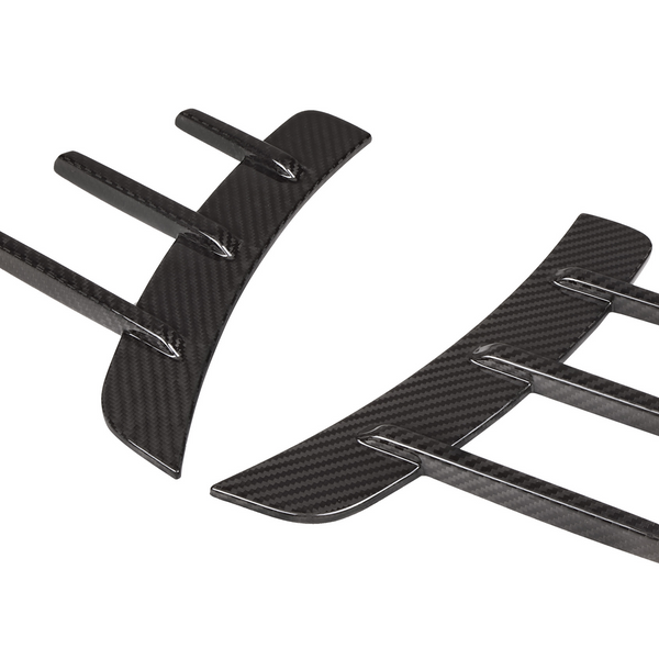 Black carbon fiber fin-like appendages curve inward, resembling aerodynamic car accessories, set against a white background.
