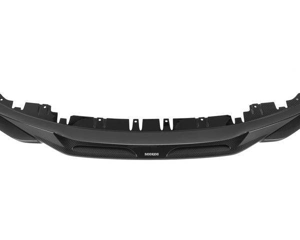 A black car diffuser, labeled "SODQOD," displays a sleek, aerodynamic design with multiple cutouts, positioned against a plain white background.