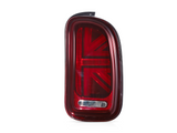 A red car taillight featuring a Union Jack design is displayed against a plain white background.