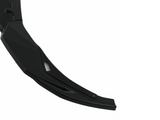 A black, curved plastic object with a smooth, angular design, positioned against a white background. The object has a small, recessed slot near its midpoint.
