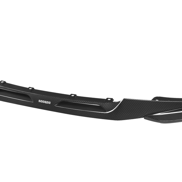 A black carbon fiber car front spoiler with aerodynamic vents and mounting holes, labeled "SOOCOO," isolated on a plain white background.