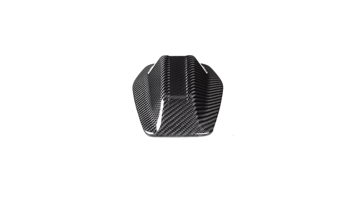 A sleek, black carbon fiber object with a streamlined, angular shape sits against a plain white background, suggesting a component for a vehicle or machinery.