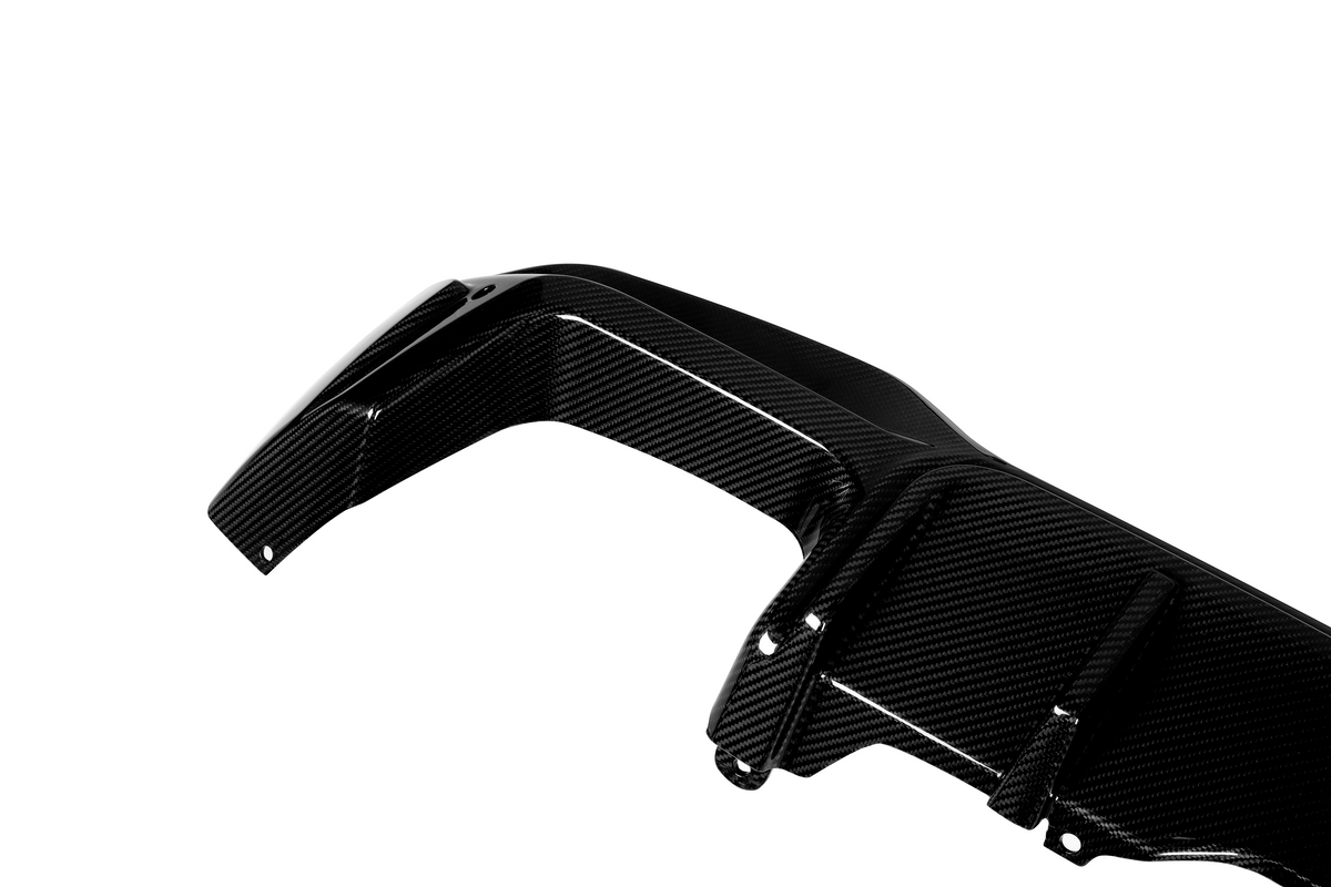 A sleek carbon fiber car part with a glossy finish, featuring mounting holes, positioned on a plain white background.