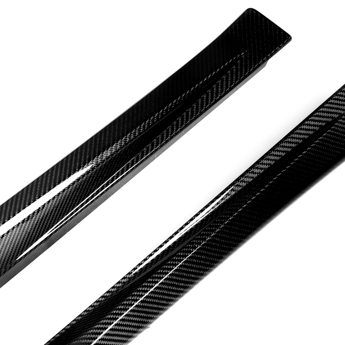 Two sleek carbon fiber components are angled diagonally across a plain white background, showcasing their glossy finish and distinctive woven pattern.