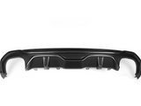 A black carbon fiber car bumper diffuser, featuring curved and angular design elements, is positioned against a plain white background. It includes attachment points and side wing pieces on either end.