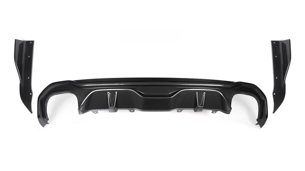 A black carbon fiber car bumper diffuser, featuring curved and angular design elements, is positioned against a plain white background. It includes attachment points and side wing pieces on either end.