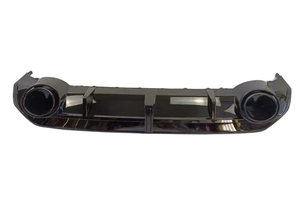 A dark-colored car bumper features two circular fog light housings and multiple vertical vents, set against a plain white background, highlighting its sleek and modern design.