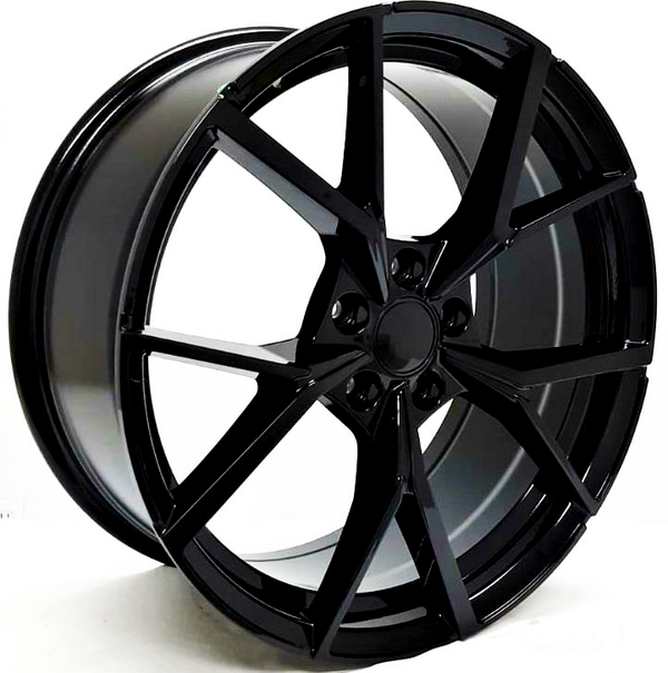 A sleek, black alloy wheel with a multi-spoke design stands against a plain white background, showcasing intricate angular patterns and a polished surface.