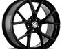 A glossy black alloy wheel with a multi-spoke design, displaying the Volkswagen logo at the center. The wheel is set against a plain white background, highlighting its shiny finish.