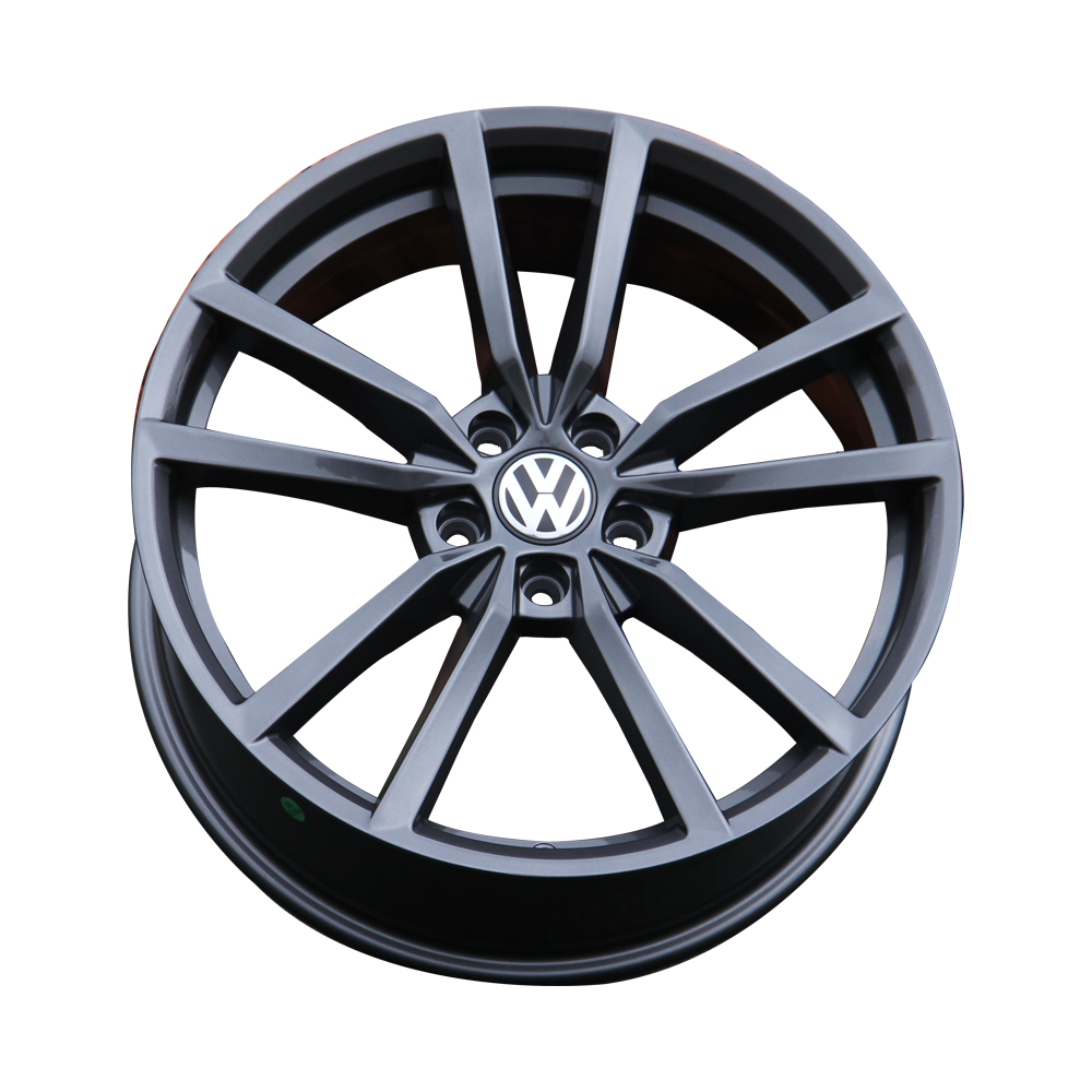 A black alloy wheel, featuring the Volkswagen logo in the center, is displayed against a plain white background.