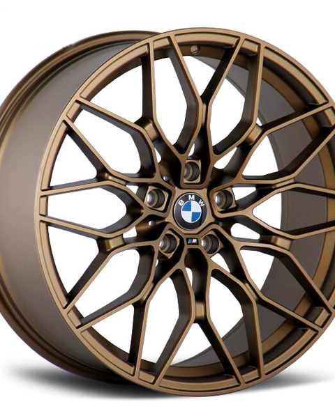 A bronze-colored BMW car wheel features a complex, multi-spoke design. The BMW logo is at the center, and the wheel is set against a plain, white background.