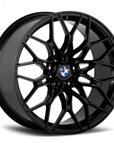 A black alloy car wheel with a complex spoke design features a central logo that reads "BMW." The wheel is displayed against a plain white background.