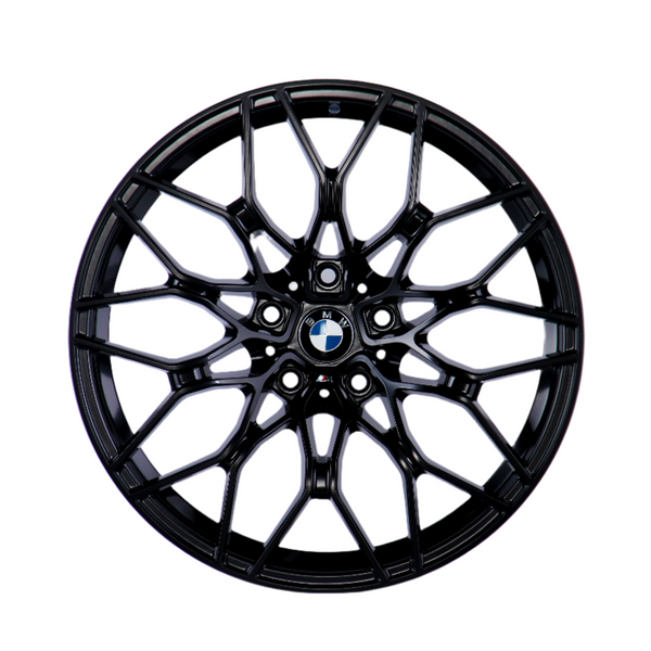 A black, multi-spoke alloy wheel with a central BMW logo, displayed against a plain white background, showcasing intricate design and structure.