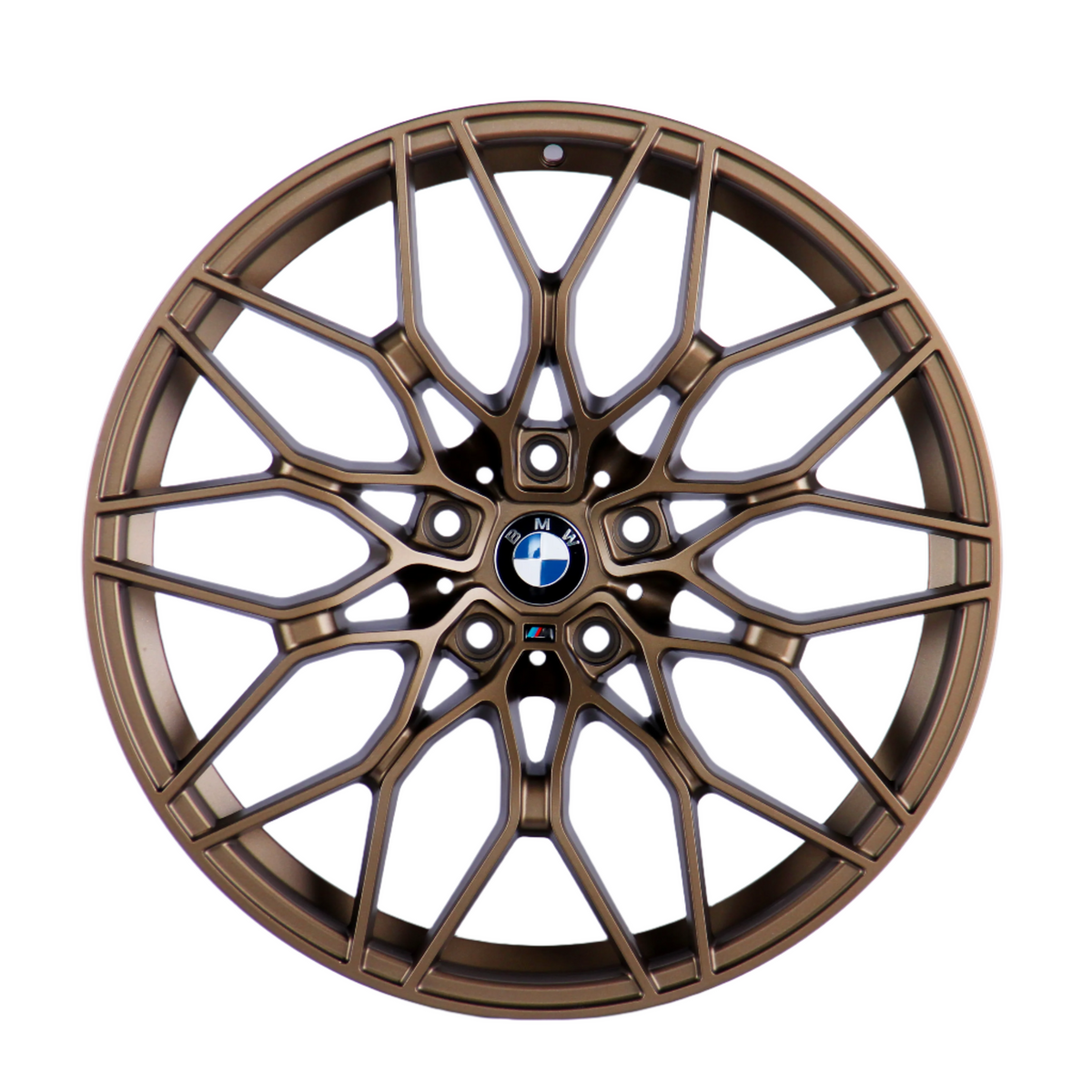 Bronze-colored, intricately designed car wheel with a multi-spoke pattern features a central BMW logo, highlighted in front of a plain white background.