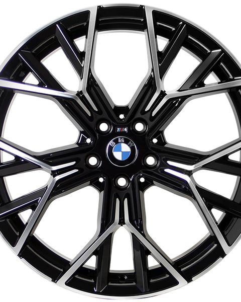 A metallic, multi-spoke alloy wheel with BMW logo at the center, designed for vehicles, displayed against a white background. The spokes feature a black and silver finish with intricate angles.
