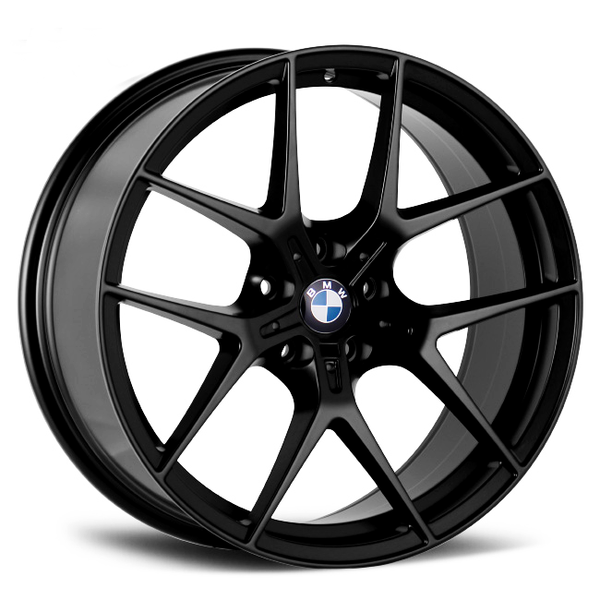 A black, multi-spoke alloy wheel displays the BMW logo at its center, seen against a plain white background.