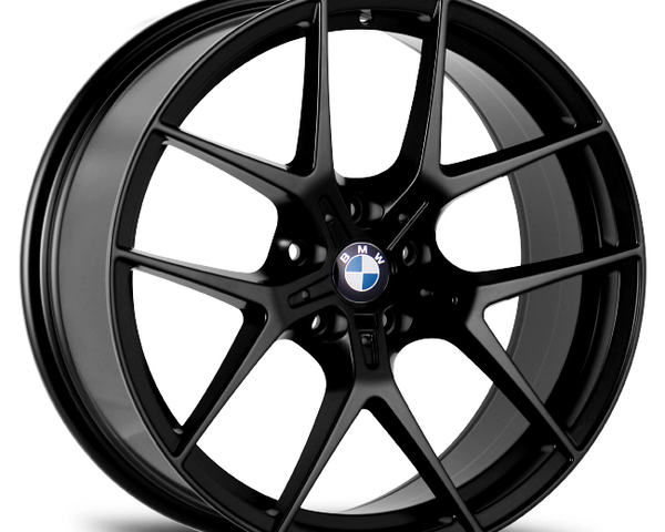 A black BMW alloy wheel with a multi-spoke design is positioned against a plain white background, highlighting its sleek and polished appearance. The BMW logo is visible at the center.