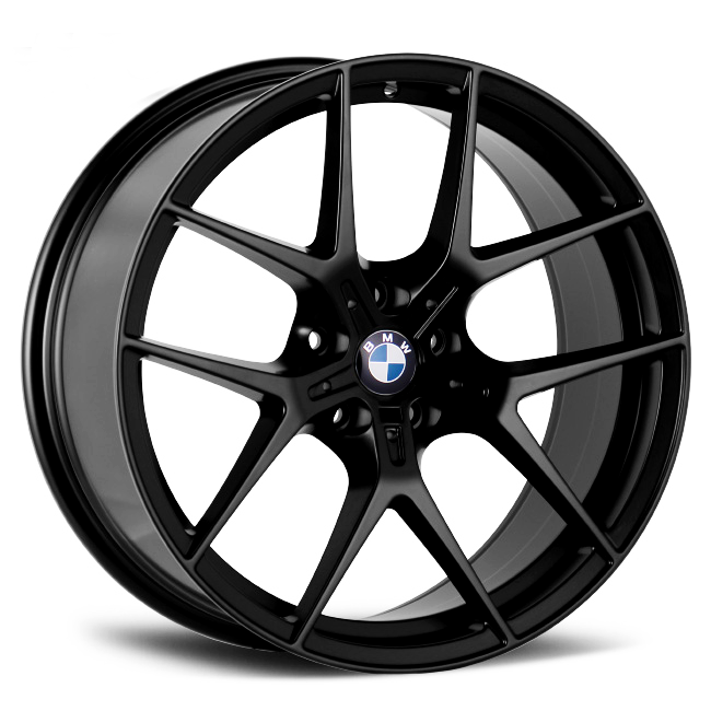 A black BMW alloy wheel with a multi-spoke design is positioned against a plain white background, highlighting its sleek and polished appearance. The BMW logo is visible at the center.