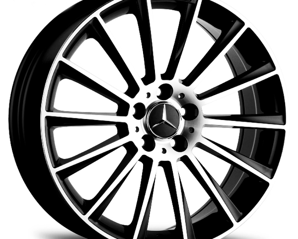 A black and silver car wheel rim features a star emblem in the center and "AMG" text on top, designed for a high-performance vehicle, against a plain white background.