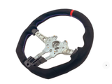 Steering wheel with exposed metal spokes and black covering, featuring red and blue stitching and a red top marker, displayed on a plain white background.