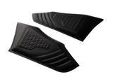 Two black, textured rubber pads feature a honeycomb pattern, lying side by side on a white surface, designed likely for gripping or protective use.