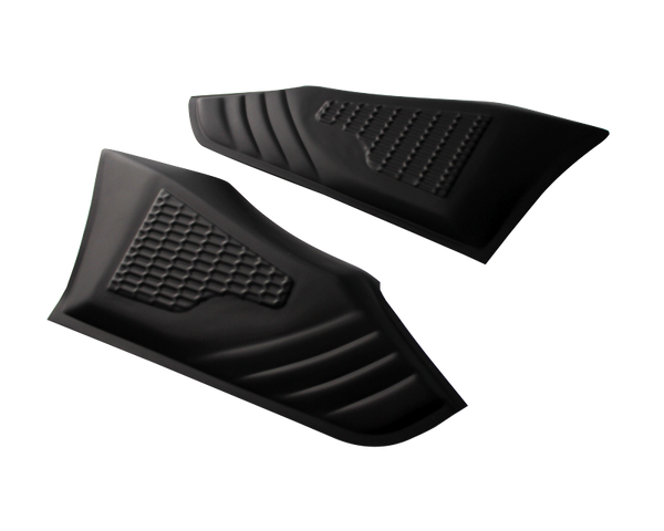 Two black, textured rubber pads feature a honeycomb pattern, lying side by side on a white surface, designed likely for gripping or protective use.