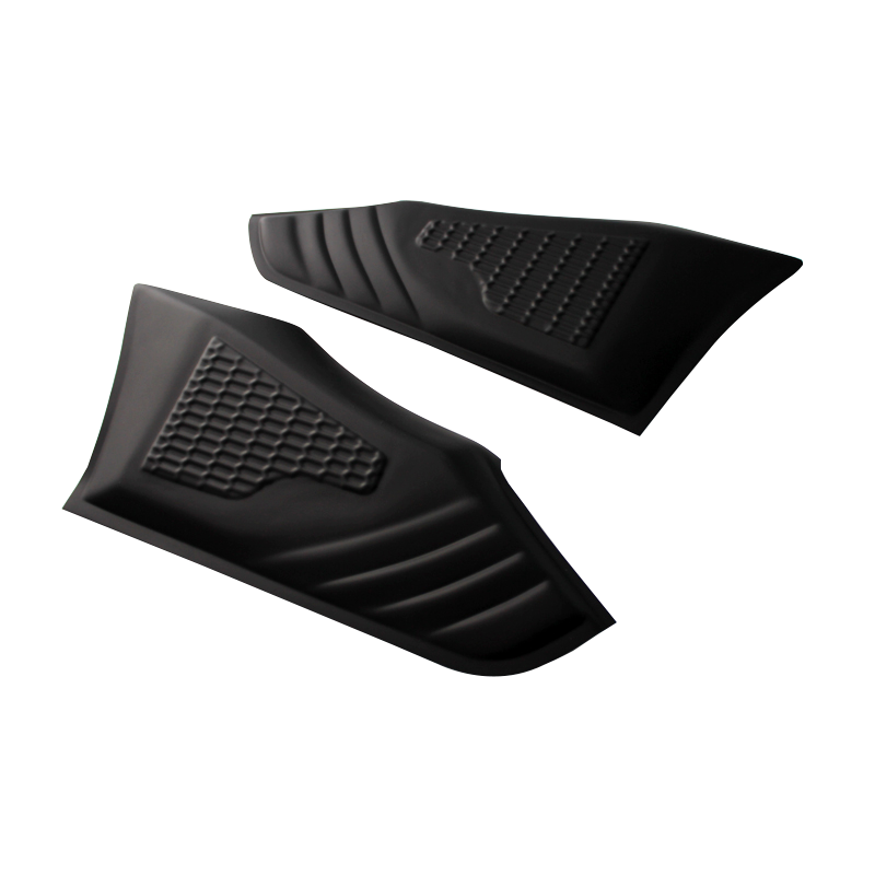 Two black, textured rubber pads feature a honeycomb pattern, lying side by side on a white surface, designed likely for gripping or protective use.