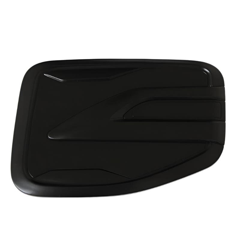 A sleek, black rectangular object with smooth, curved edges, featuring raised geometric patterns. It's set against a plain white background, suggesting focus on design and form.