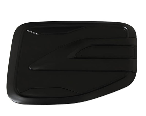 A sleek, black rectangular object with smooth, curved edges, featuring raised geometric patterns. It's set against a plain white background, suggesting focus on design and form.