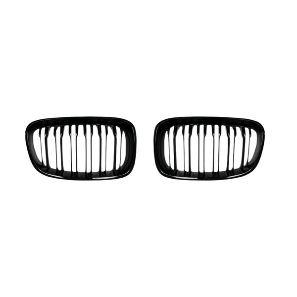 Two black, oval-shaped car grilles with vertical slats sit side by side against a plain white background, suggesting automotive components for vehicle front ends.