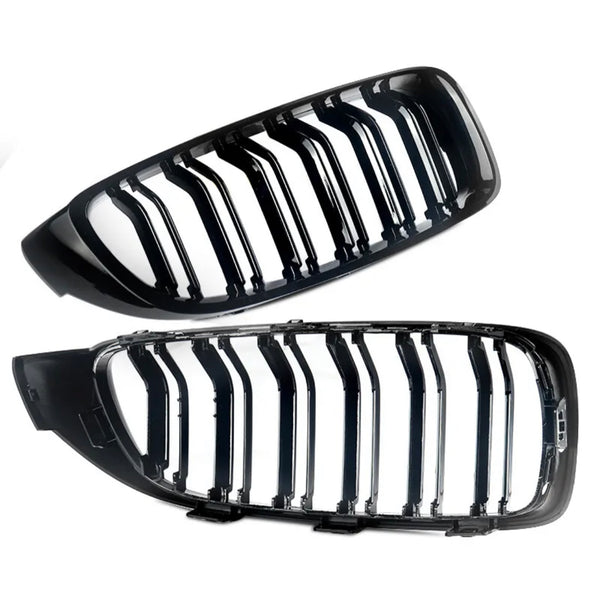 A pair of sleek, glossy black car grille inserts, each featuring vertical slats, is displayed against a plain white background.