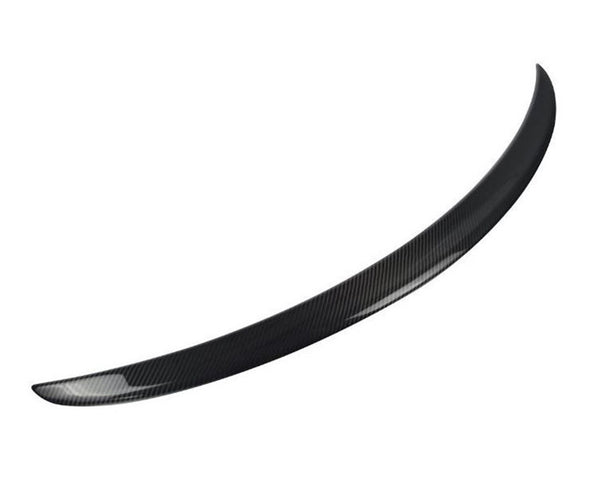 A curved, black carbon fiber car spoiler is displayed, isolated against a plain white background, emphasizing its smooth, aerodynamic design.