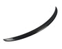 A curved, black carbon fiber car spoiler is displayed, isolated against a plain white background, emphasizing its smooth, aerodynamic design.