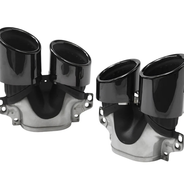 Two shiny black dual exhaust tips, mounted on metallic bases, are displayed on a plain white background. They have a sleek, curved design and multiple attachment points.