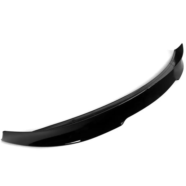 A glossy black car spoiler, resting against a white background, showcases its aerodynamic, curved design intended for attachment to a vehicle's rear.