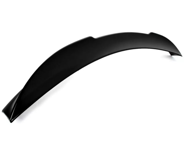 A black, curved car spoiler rests on a plain white background, displaying its smooth, aerodynamic design intended for vehicle performance enhancement. No text present.