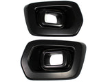 Two black, rectangular exhaust tip covers with beveled edges, placed side by side on a white background, showing their hollow interior.