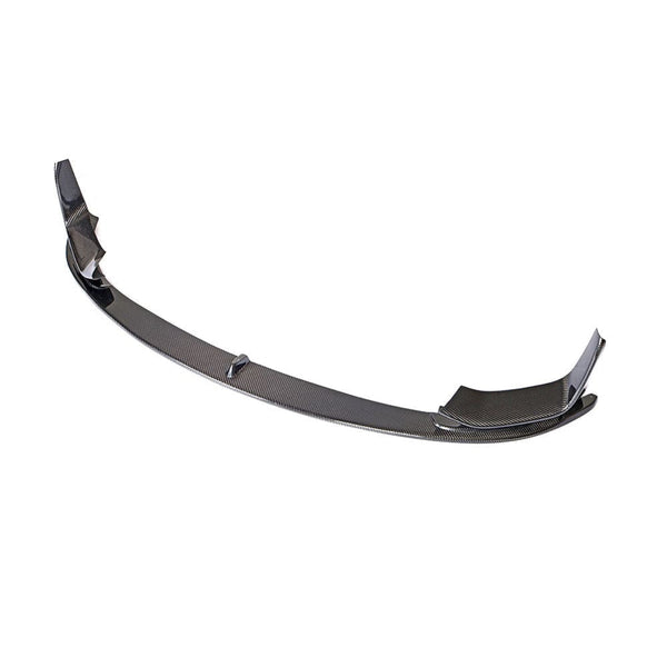 A carbon fiber car front lip spoiler is shown, arched with winged ends, designed to enhance aerodynamics. It's isolated on a plain white background.