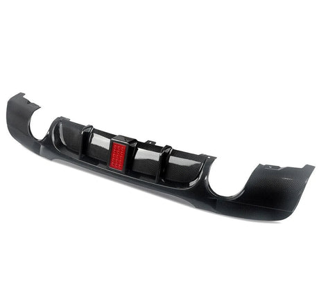A carbon fiber car diffuser with a central red LED light is positioned on a white background, designed to improve aerodynamics and add visual appeal to the vehicle's rear.