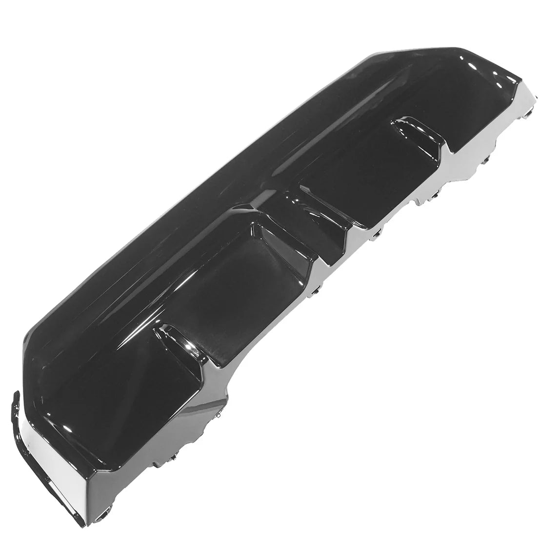 A glossy black car bumper with defined contours and multiple ridges lies on a white background, highlighting its sleek design and potential aerodynamic use.