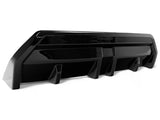 A sleek, black car diffuser sits on a white background, featuring angular design elements and aerodynamic fins, suggesting use in automotive rear bumper applications.