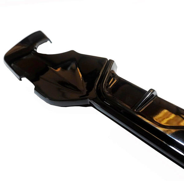 A glossy black plastic cover, featuring a curved design with ridges, is displayed against a white background. It appears to be a component possibly for protective or decorative use.