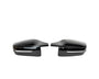 Two sleek, black side mirror covers are aligned symmetrically, facing inward, against a plain white background.
