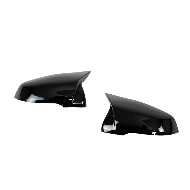 Two black side mirror covers are shown, facing each other, with a glossy finish, placed against a plain white background.
