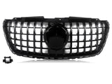 A black car grille features a grid design with a central circular emblem area, set against a white background. A detached rectangular component is located in the lower left corner.