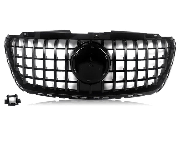 A black car grille features a grid design with a central circular emblem area, set against a white background. A detached rectangular component is located in the lower left corner.