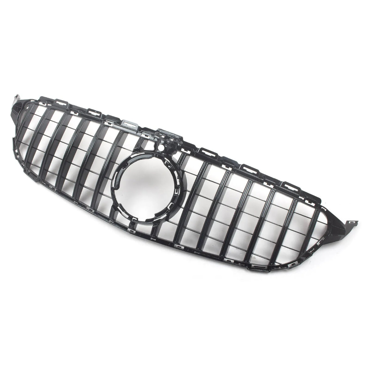 A glossy black car grille with vertical slats features a central circular emblem area. It's set against a plain, light background, emphasizing its sleek design.