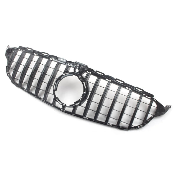 A glossy black car grille with vertical slats features a central circular emblem area. It's set against a plain, light background, emphasizing its sleek design.