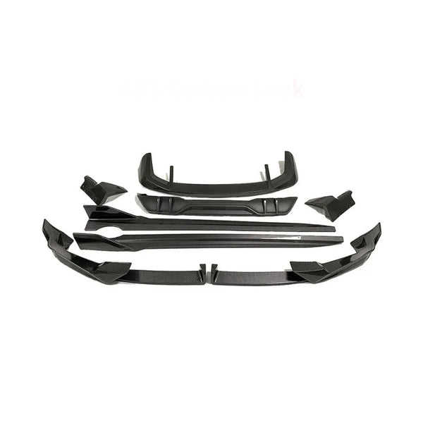 Car body kit parts arranged on a white background, featuring multiple angular black pieces designed for aerodynamic enhancement. Text reads "ABS Carbon Look."